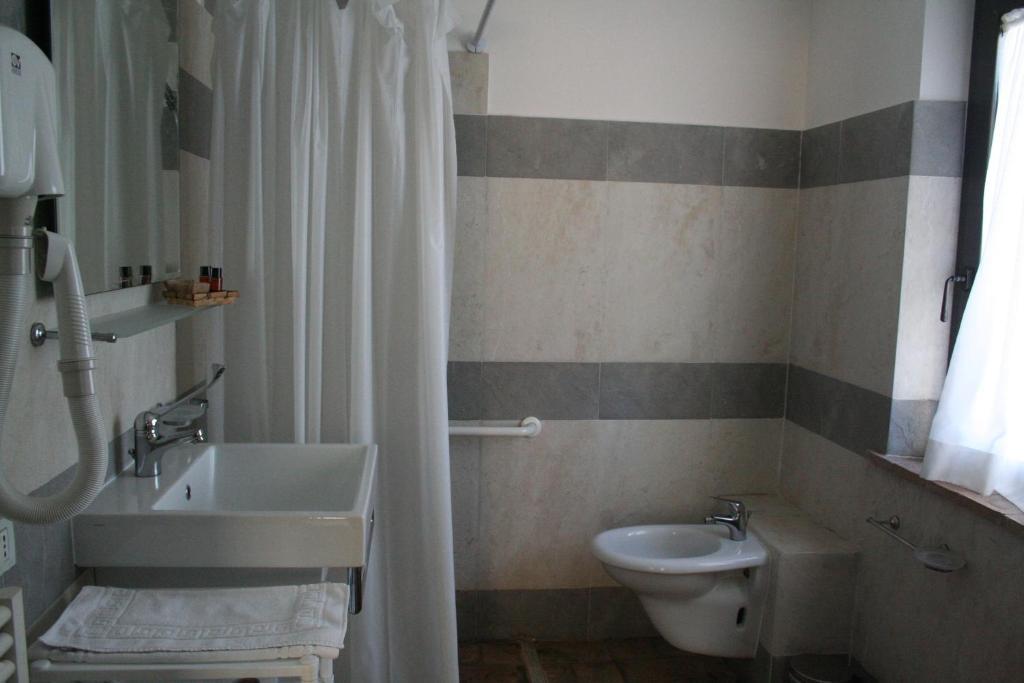 Které jsou ty nejlepší hotely v okolí atrakce Cascate del Mulino? Saturnia Pokoj fotografie